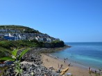 Enjoy a day on the beach at New Quay, you may just spot a dolphin or two