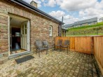 Large rear enclosed patio area, perfect for your dogs to be let off the lead