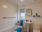 Bathroom with full bath and shower over Bathroom with full bath and shower over