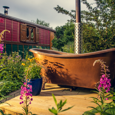 Handcrafted gypsy roulottes in a wildflower meadow